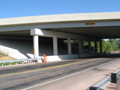 05 - Completed project. The pier caps were reconstructed, and the abutments, pier columns and concrete slope walls were repaired. In addition to the bridge work, parapets and guard rails were added along SH76 for protection.