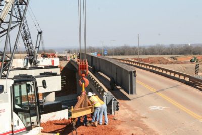 05 - The steel plate girders were staged on the existing bridge, during erection operations.