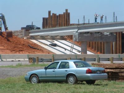 03 - During Phase 1, steel sheet piling was driven to retain the new and existing abutment embankments. The abutments, piers, superstructure components and approach slabs had to be built with construction joints to accomodate phased construction.
